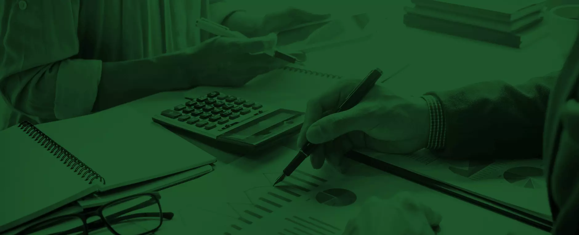 Professional accountant reviewing financial documents for small business client in modern office